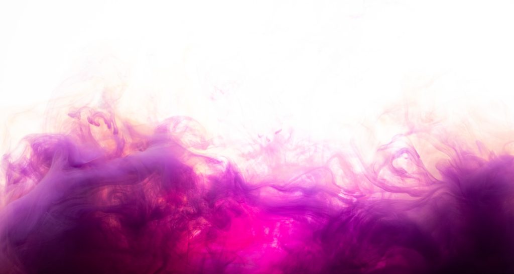 a pink and purple substance is in the air